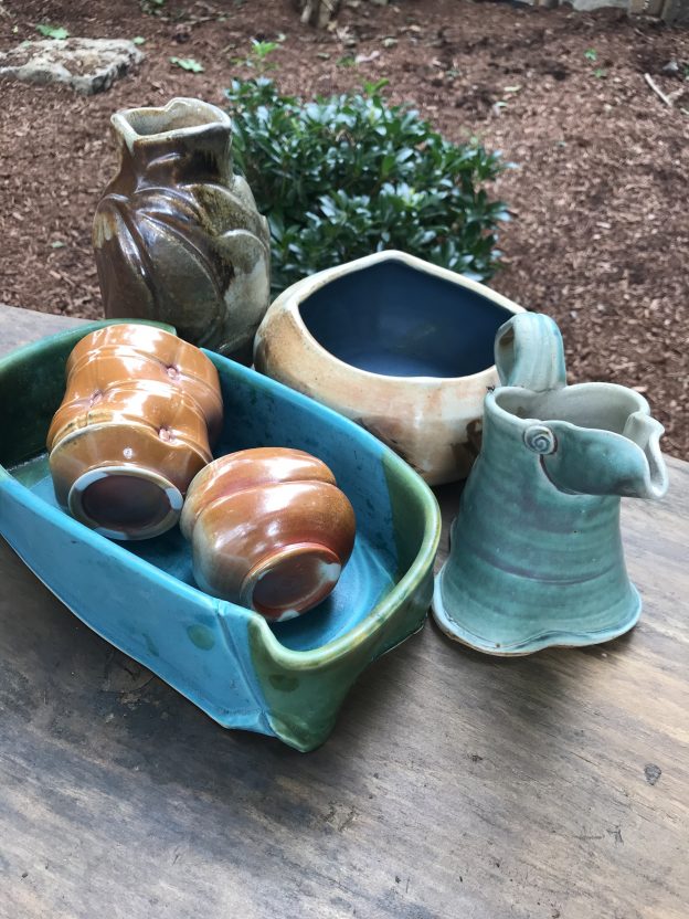 Collection of wheel thrown and altered pieces by various artists. Cassarole, pitcher, teabowls, vase